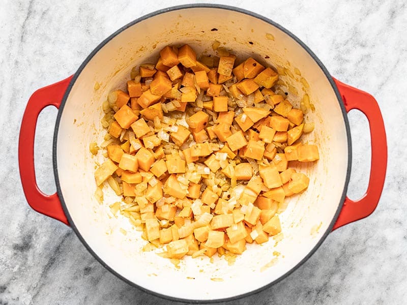 Add Diced Sweet Potato Cumin and Red Pepper to Pot
