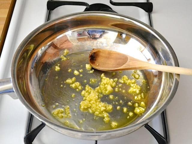 Garlic and Oil in skillet on stove top 