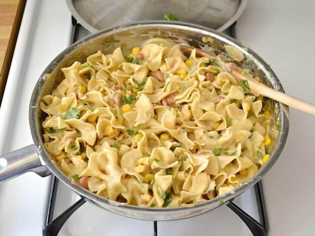 Sour Cream and Greens added to cooked ingredients in skillet 