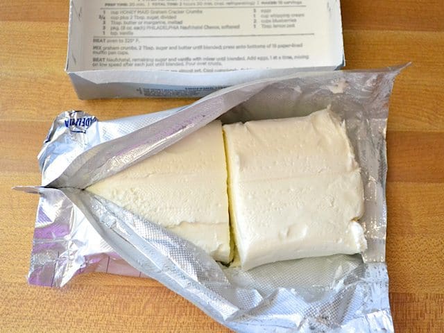 Open block of cream cheese in package 