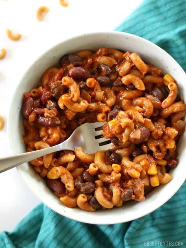 A bowl of One Pot Chili Pasta on a teal napkin