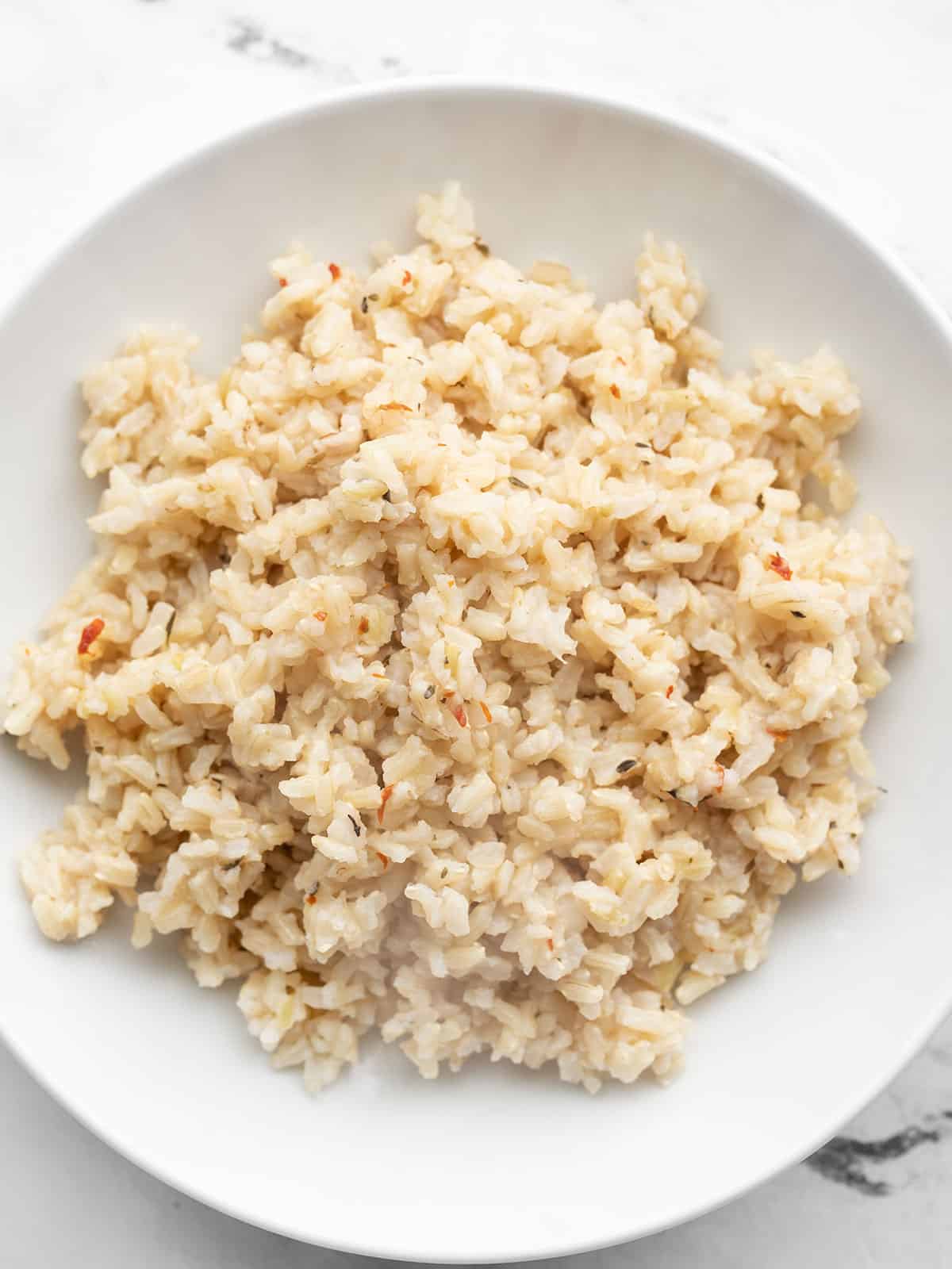 Overhead view of a bowl full of seasoned rice