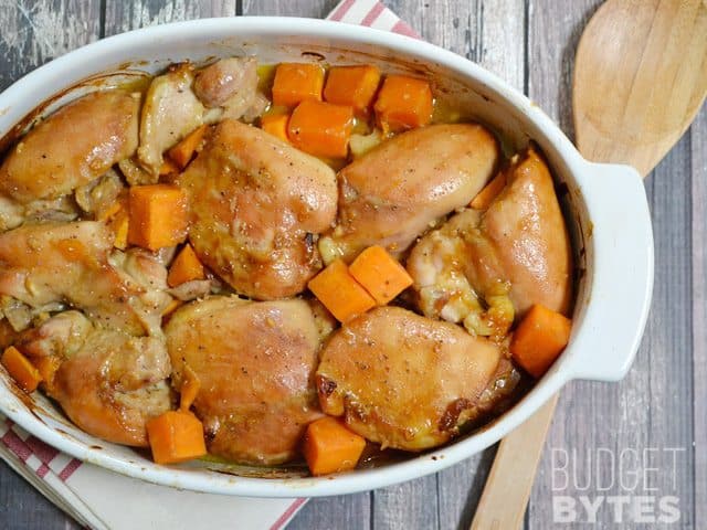 Top view of a casserole dish of Soy Dijon Chicken Thighs with Sweet Potatoes