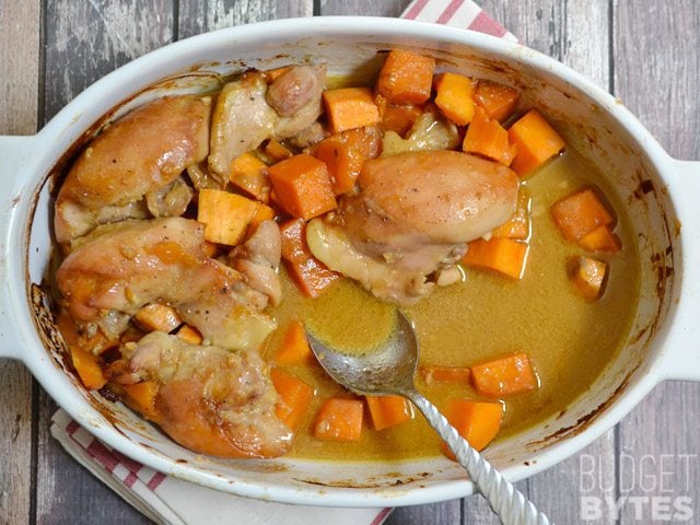Soy Dijon Chicken Thighs with Sweet Potatoes, sauce in bottom of dish 
