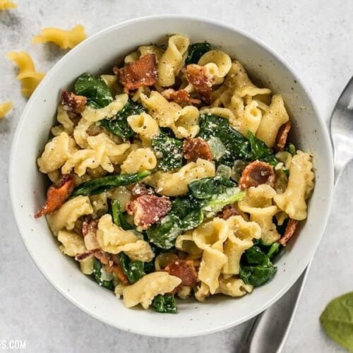 Bacon and Spinach Pasta with Parmesan is a quick and flavorful weeknight dinner that only requires a few ingredients. BudgetBytes.com