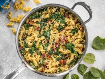 Bacon and Spinach Pasta with Parmesan is a quick and flavorful weeknight dinner that only requires a few ingredients. BudgetBytes.com
