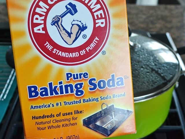 Baking soda ready to be poured into pot of boiling water 