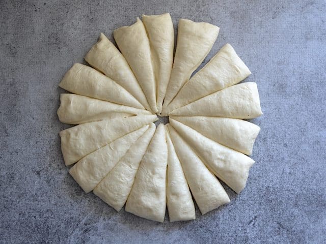 Dough ball cut Into 16 wedge pieces