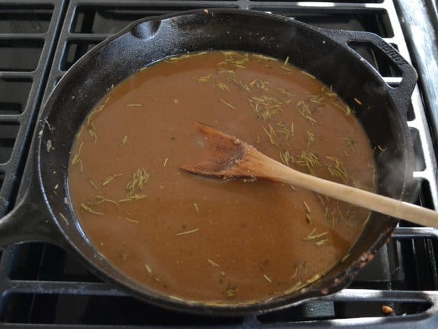 Deglazed pan with soy, Dijon, and rosemary added to broth