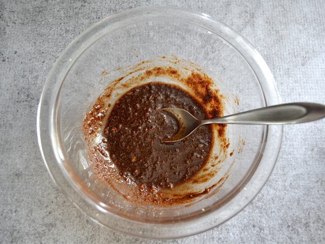 Five Spice Rub ingredients in bowl with spoon 
