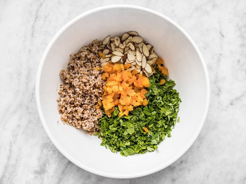 Parsley Salad Ingredients (bulgar, apricots, almonds and parsley) in bowl 