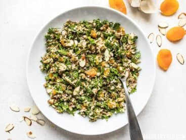 This Parsley Salad with Almonds and Apricots is savory, sweet, crunchy, and drenched in a tangy homemade vinaigrette! Holds up well to refrigeration and perfect for meal prep! Budgetbytes.com