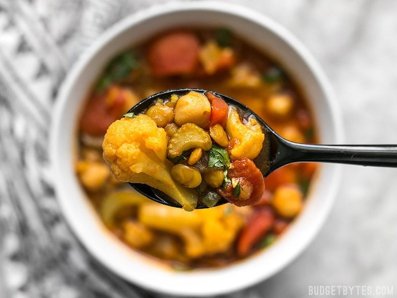 A close up spoonful of Moroccan Lentil and Vegetable Stew 