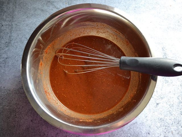 One cup of broth added to spices in mixing bowl and whisked together 