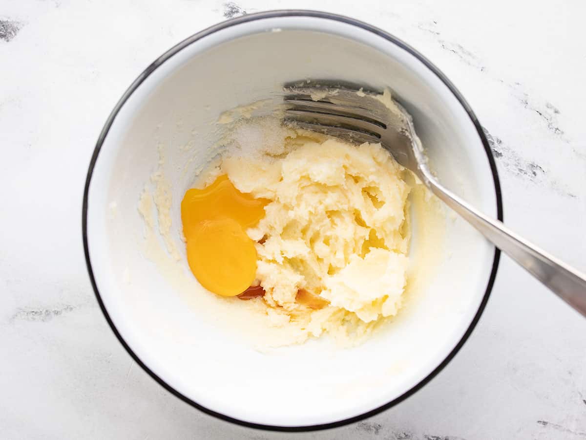 Egg yolk and vanilla added to the bowl