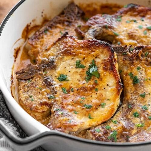 baked honey mustard pork chops in a casserole dish from the side