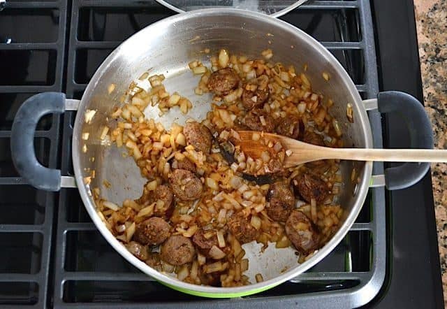 Onion and Garlic added to skillet with sausage 