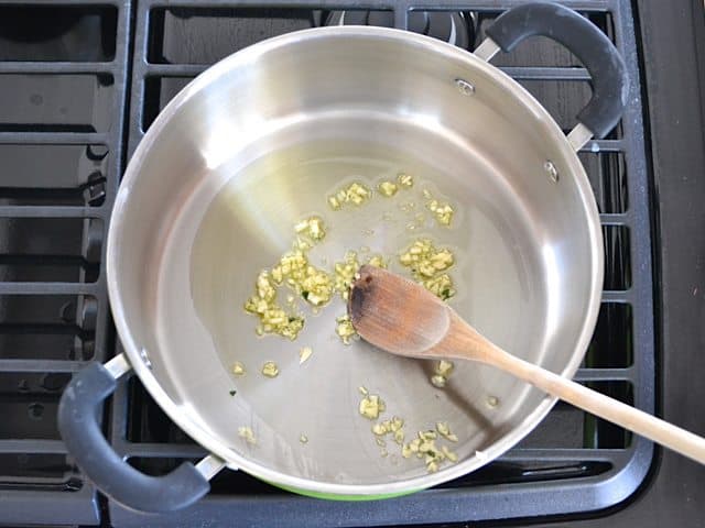 Sautéing Garlic in pot on stove top 