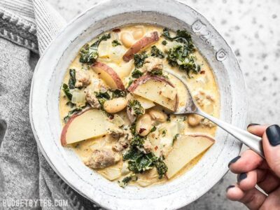 A spoonful of homemade Zuppa Toscana ready to be eaten.