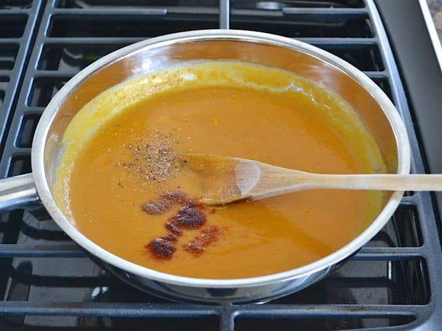 Pumpkin, Broth and Spices added into pan on stove top 