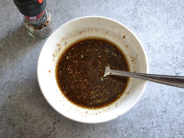 Balsamic Marinade in small bowl with fork 
