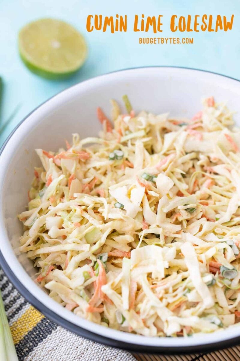 Side view of a bowl of cumin lime coleslaw