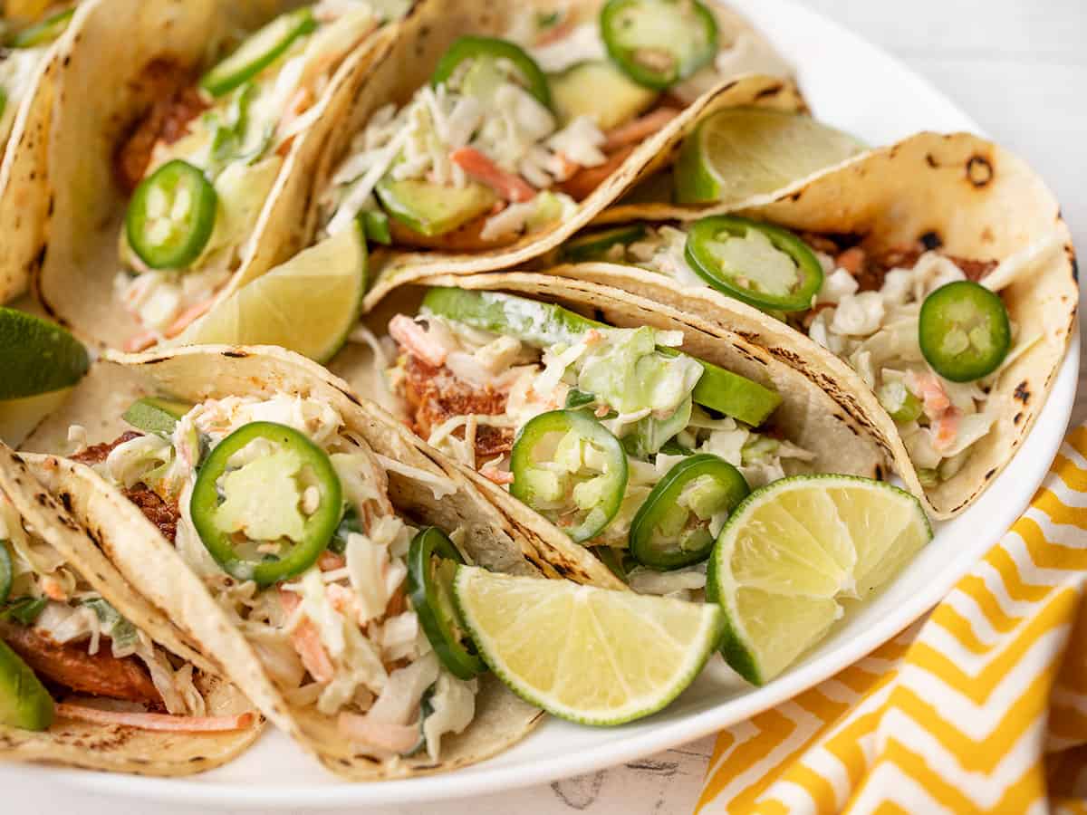 Side view of fish tacos on a platter