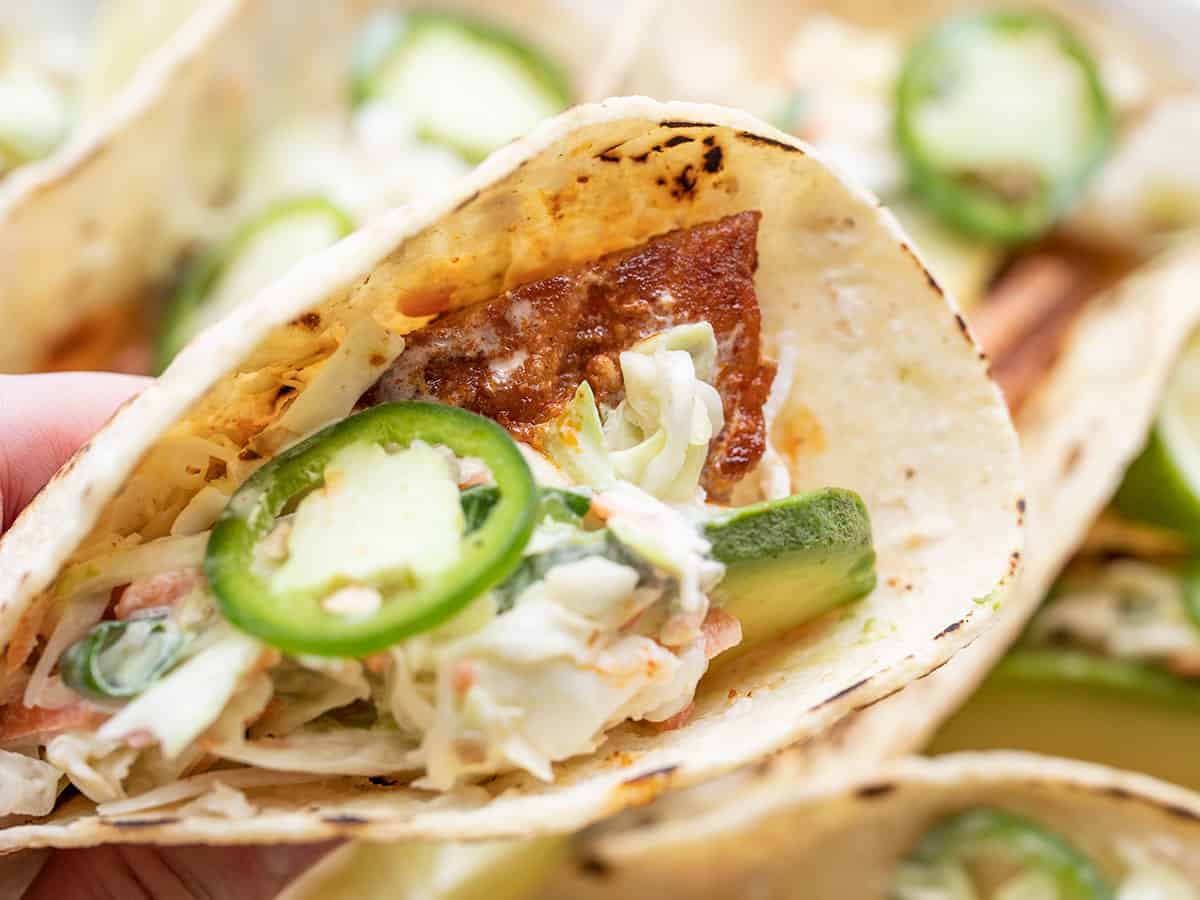 close up of a fish taco in a hand