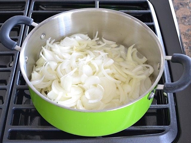 Sliced Onions in pot on stove top 