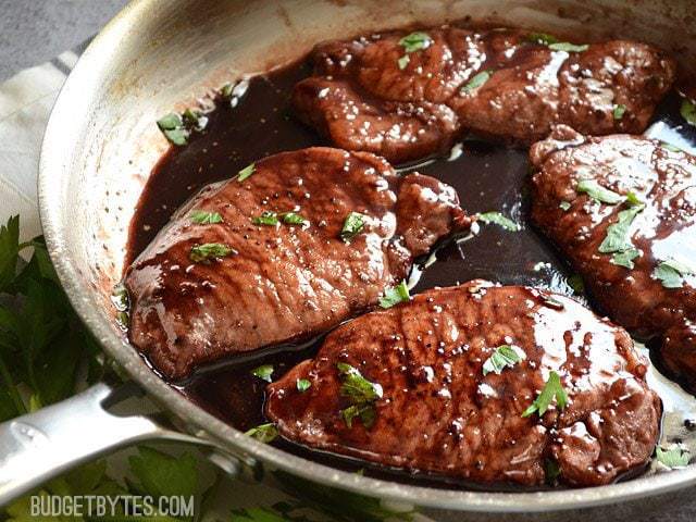 Close up of a pan of Blackberry Sage Pork Chops 