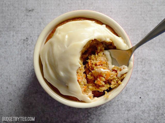 Top view of one cup of Carrot Cake with a spoon 