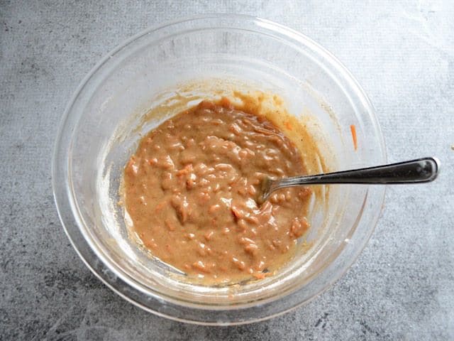 Dry ingredients mixed with wet ingredients in mixing bowl 