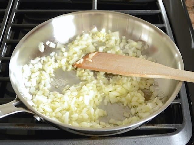 Onions and Garlic in skillet on stove top 