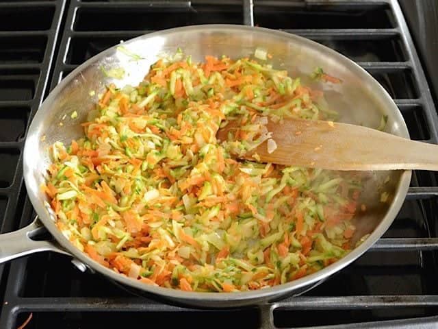Shredded Carrot and Zucchini added to skillet with garlic and onions 