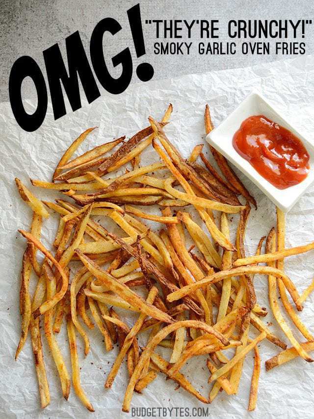 Top view of Smoky Garlic Oven Fries on a paper towel with a side of ketchup 