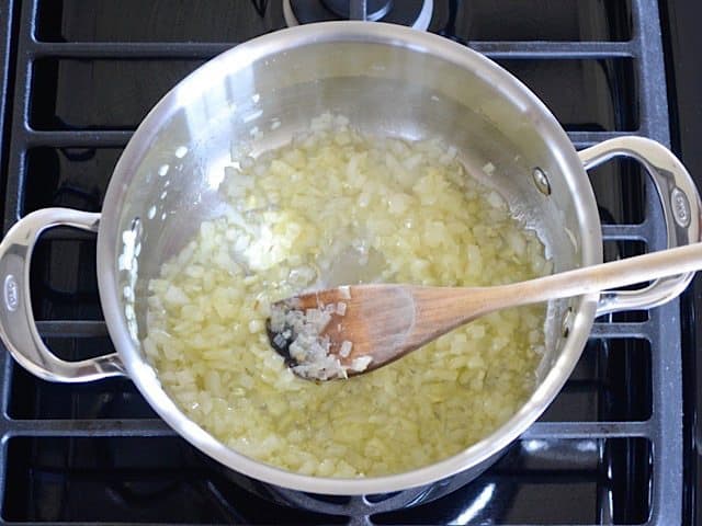 Sweat Onion and Garlic in pot on stove top 