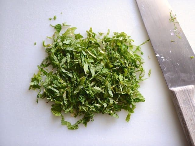 Chopped mint, knife on the side 