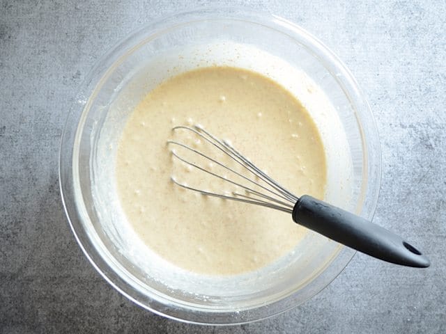 Crepe mixture mixed together in bowl with whisk until smooth 