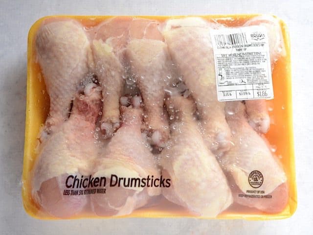 Package of raw chicken drumsticks