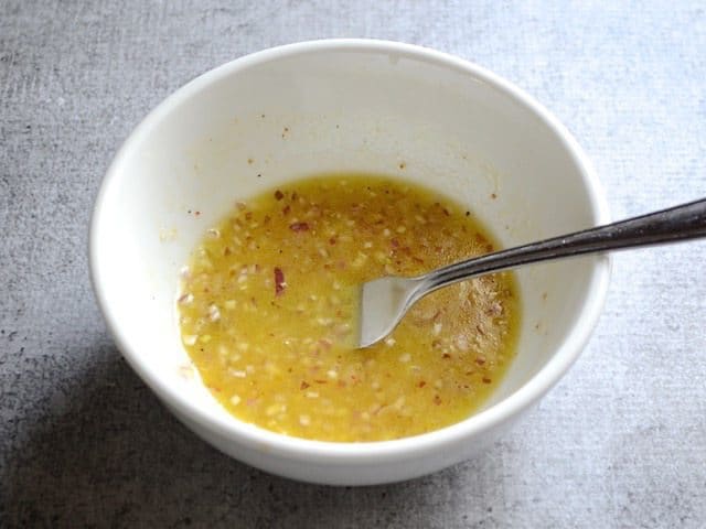 Mixed Shallot Dressing in bowl with fork 