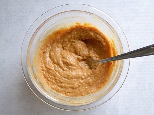 Peanut Butter and Water added to spice ingredients in bowl and mixed together 