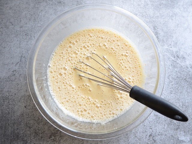 Milk added to wet ingredients in mixing bowl and whisked in 