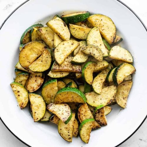 Overhead view of a bowl full of lemon pepper zucchini