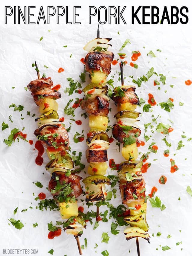 Three Pineapple Pork Kebabs garnished with cilantro and sriracha with title text across the top