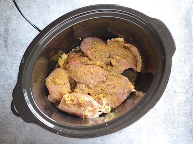 Chicken and seasoning in slow cooker 