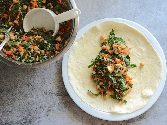 Salad scooped onto tortilla