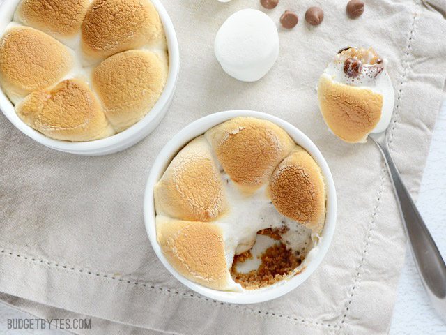 Two Peanut Butter S'mores Pots, one with a spoonful removed