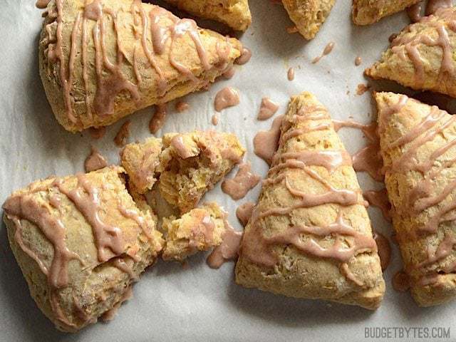 Overhead view of apple pie scones, with one slightly crumbled
