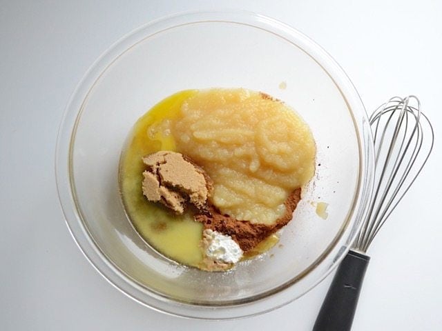 Wet ingredients in a glass mixing bowl, whisk on the side