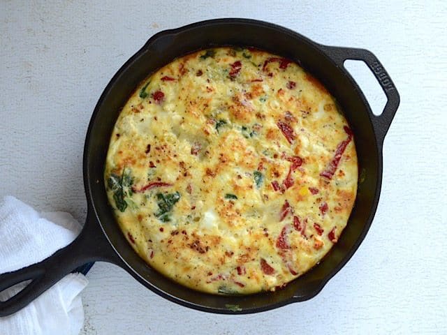 Baked Roasted Red Pepper and Feta Frittata in the skillet, not sliced
